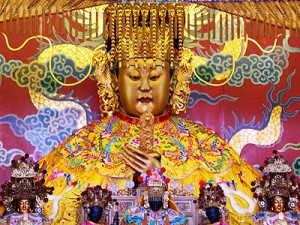 goddess with people worshiping at bottom of image